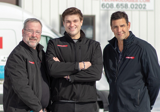 The Concrete Lifting Technologies team with company mascot Caesar. Pictured, from left: General Manager Kevin Schiltz, Business Development Manager James Weber and Owner David Hare.